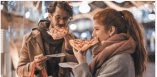 woman eating pizza